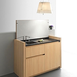 Since 1993 French kitchen manufacturer Kitchoo has been designing and producing the most ingenious compact kitchens. In spite of their small outer dimensions the kitchens provide all the basic functionalities of a usual kitchen.