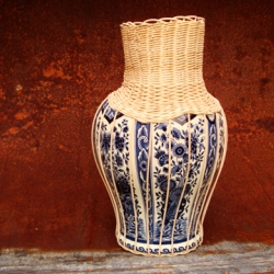 Combining two Dutch traditional trades into one centerpiece. The Delfsblue vases are broken vases, combining the broken vases with Dutch basketry it becomes an all Dutch centerpiece.
