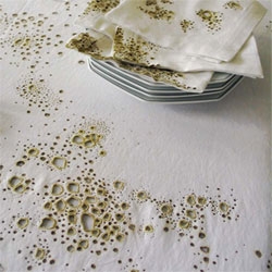 Conceptual textiles by Julie Krakowski - Coffee & Cigarettes explore the traces and stains left on linens.