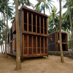Studio Mumbai's Palmyra House, constructed from louvers made from locally harvested Palmyra trees, allowing the facade to be both open and airy or closed for more privacy and protection.