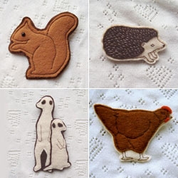 Kate Broughton has a sweet line of felt animal brooches. 