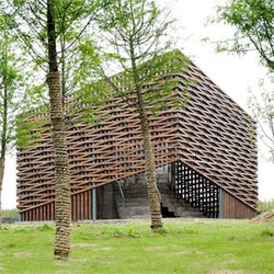 Till Schweizer designed this Welcome Center for the JinHua Architecture Park in China. I love the latticed exterior that provides a filter for light, air and privacy, as well as a texture against the natural surroundings.
