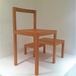 "Pluralism" is a wooden chair created by Danish designer Cecilie Manz. It seems to be composed of several archetypal decreasing size chairs.