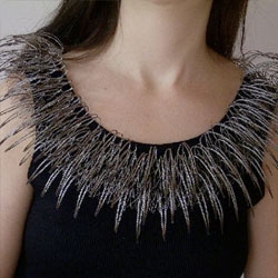 Crazy wire frame jewelry by Ines Schwotzer, using weaving and braiding techniques.