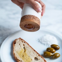 Functional set highlights the value of the quality of olive oil as an independent food. Container for olive oil consists of an applicator in the form of a ball for controlled dispensing and smearing oil on the bread on the principle of a roll on.