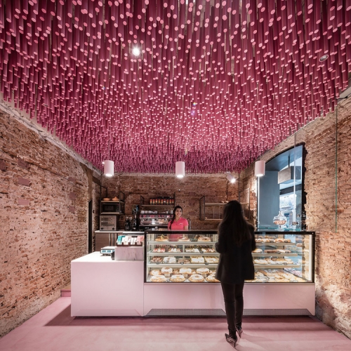 Architect and designer Virginia del Barco, founder of Spanish practice ideo arquitectura, suspended 12.000 wooden sticks within this bakery in Madrid. 
