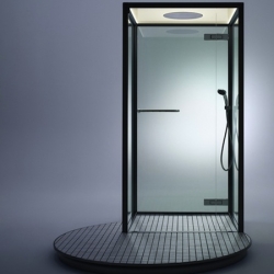 'Booth' is a minimalist shower with an uncommon circular platform by Inax.