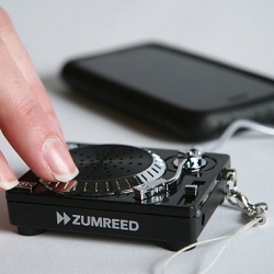 Mix it up! Tiny turntable-style speaker allows you to not only amplify your music, but let's you scratch !