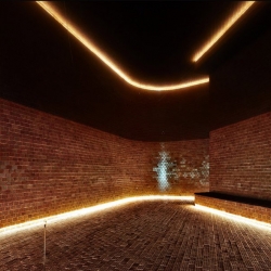 Approximating transparency with clay brick in a structure by mab architects in Greece.