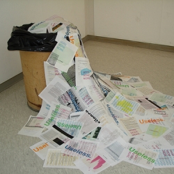 this is an installation i did (screenprinting on found computer paper). its a social commentary on our overuse of copy machines and computer paper, and how they become ultimately wasted.