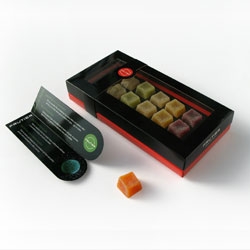 Packaging of Frutier, gourmet sweets made of natural fruit. Attractive and exclusive packaging. The window of the pack shows the colourful sweets, contrasting with the black colour that it identifies the brand.