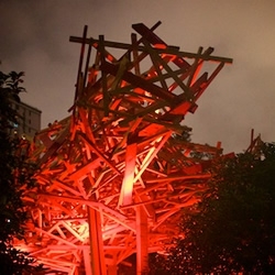 Belgian artist Arne Quinze’s Red Beacon in Shanghai is typically unrestrained, with 55 tonnes of wooden planking, seemingly slung in fury at a canopy structure.
