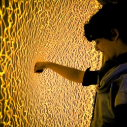 Firewall is a recent project from Mike Allison and Aaron Sherwood.  It is a spandex screen that when pressed into creates beautiful fiery visuals and expressively plays music.  A piece a new interactive media that re-imagines the touch interface.