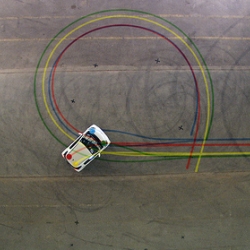 Two typographers (Pleaseletmedesign) and a pro race pilot collaborated to design a font with a car. The car movements were tracked using a custom software, designed by interactive artist Zachary Lieberman.(openframeworks.cc )