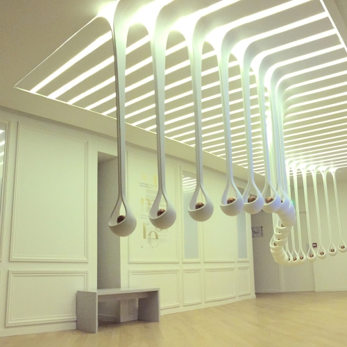 Scent Drops by Harvey & John for Grand Museé du Parfume, Paris. Drops of white corian hang from the ceiling cradling 25 scents. Visitors twist them to change the language, pick them up to smell and put it to their ear to listen and learn about ingredients used.