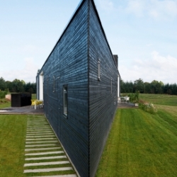 This angular and unique house, set in the Danish woods, belongs to a family of four.  Shared with us by thedesignerpad.