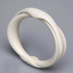 Two part bangle cuff: designer Anthony Tammaro.  The material is nylon by the means of rapid manufacturing selective laser sintering. Slip this piece on to the wrist. Enjoy yourself. Wexler Gallery Philadelphia.