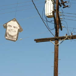 artist ABOVE kicks off his 4-month tour by hanging movie star arrow mobiles in Hollywood. 