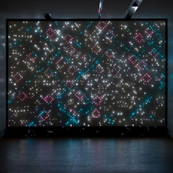 Astrid Krogh's new ‘light tapestry’ currently exhibited within her solo exhibition at Galleri NB in Viborg (DK). ‘Morild’ consists of a perforated wooden wall with illuminated spots, with ornamentally arranged  fiber-optic threads.