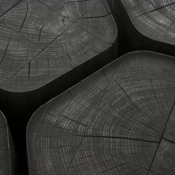 Normal Studio's Basalt, set of five coffee tables made from burnt wood.