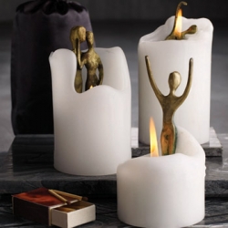 Spirit candles have bronze sculptures hidden within...
