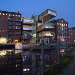 The proposal by Aedas Architects of Leeds is one of shortlist of 36 The Calls Design Competition. It contains an office building with stacked containers in Leeds, UK.