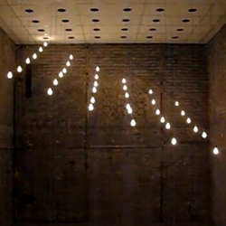 Swedish artist Christian Partos' playful light installation with 36 bulbs swiftly and elegantly ‘dancing’ in space.