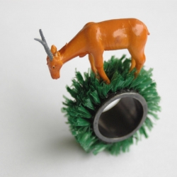 Silver , plastic and Astroturf, "Balancing Antelope" ring from the "Portable Landscape Series"