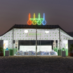 In celebration of Artist Damien Hirst's retrospective, the fashion aficionados over at Prada teamed up with the artist to created a Pharmacy Juice Bar, installed in the uninhabited Doha desert, like a mirage of sorts.