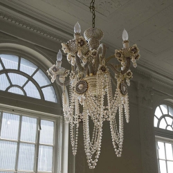 erickson beamon brings their innovative and decadent aesthetic to home decor and creates an exquisite lighting piece. japanese glass pearls, swarovski crystals, gold plating, glass and brass chains, etc the glam rock chandelier is a handmade objet d'art.