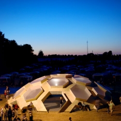 At the Danish Roskilde Music Festival, a temporary plywood dome installation, from architects Kristoffer Tejlgaard.