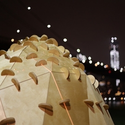Skylights: Dumbo is a sculptural pavilion that utilizes ambient lighting within Brooklyn Bridge Park to show star constellations on the ground via cast shadows, poetically addressing the side effects of light pollution in urban settings.