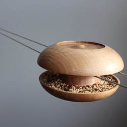 Urbanproduct Studio hand turn every 'Spun' bird feeder which holds water and seed, remaining virtually squirrel proof on its suspended wire. 