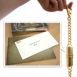 Mail Call! Diesel sent over their "Jeans Chain" ~ the hefty shiny gold bling to hang from your belt loops with a vial of perfume inside... OR anything else you want to stash in the container. See the unboxing.