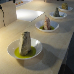By stirring a stone in a pool of olive oil, we give the illusion that it is dissolving and producing a flavoured sauce.