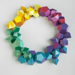Hand painted paper polygon wreath with glitter detail for Gray Magazine. From Matthew Parker Events in Seattle, WA. These polygon wreaths are for sale at the Frye Museum Store.