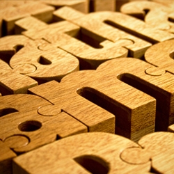 Created by John Christenson, Nuzzles® are custom designed handmade wooden name puzzles, each with its own unique typographic style. Every puzzle is crafted from a single block of wood.