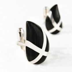 "Passion" cufflinks from John Ferdinand, a new men's accessories brand.  Styled in silver and inlaid with ebony.  The wood used is actually offcuts from furniture manufacturing.