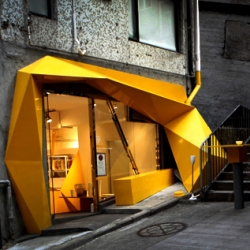 Hong Kong's new concept store, Konzepp, is full of freakishly fun little gadgets and trinkets. To complement the stores selection, designer Geoff Tsui, co-founder of design firm 33WILL, created an angular and twisted bright yellow facade.