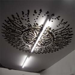 Oliver Kosta Théfaine is a French artist who uses a BIC lighter in the most unique way; to burn intricate designs into ceilings.