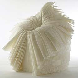 Pleated recycled textile chair  by Nendo ala Issey Miyake's 'Pleats Please'.