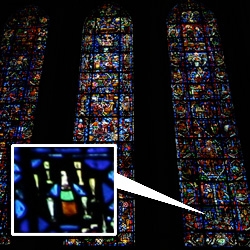 Ancient stained glass product placement? Found in the Notre Dame de Reims (where the kings of france were crowned) ~ Veuve Clicquot yellow labeled champagne bottles hidden in the panels...