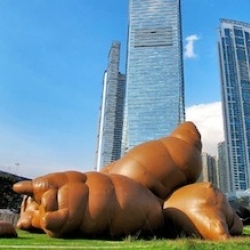 Giant inflatable objects on show at the West Kowloon Cultural District, Hong Kong, featuring Cao Fei's House of Treasures, a giant suckling pig filled with roast pork inflatable cushions and Paul McCarthy's giant poop.