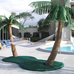 YOUR OWN PIECE OF PARADISE. for 8 grand, you get a fake island, with two fake palm trees to hold your not-fake hammock for two with drink holder and pillow... and trees have integrated dual-control mist mechanism.