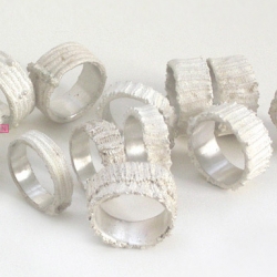 Ripprings, by Verena Schreppel, a young designer from hamburg, germany. each one is cast from a one-off piece of stitched fabric. leaving the white cast skin of the silver perfects the transposition and causes confusion.