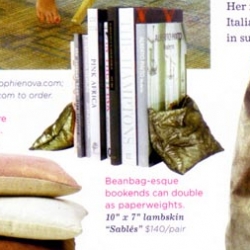 Sophie Nova's bean bag like bookends that are featured in Domino are adorable, and such a nice wat to mix up the usual stiff bookends with these soft golden pieces.