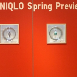 Fantastic new Spring 09 setup of the glass box in the Uniqlo Soho flagship store. Little dolls wearing original garments from the Spring collection are behind magnifying glasses for a preview of the season.
