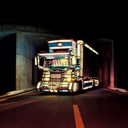 Photographer Masaru Tatsuki spent ten years with the truckers and their decotora (short for decorated trucks) of Japan’s highways.   