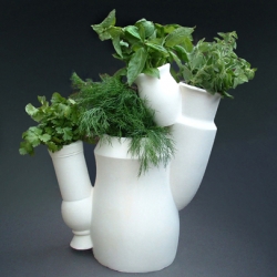 The Multi Culti by Bas van der Veer allows you to plant four herbs or plants in one communal vase. Available in black or white.