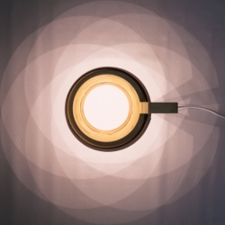 The reading light remastered. Focusing on using high intensity LEDs to replace the conventional lightbulb. This allowed for he exploration of a 'hollow' light design where no light source is visible. 